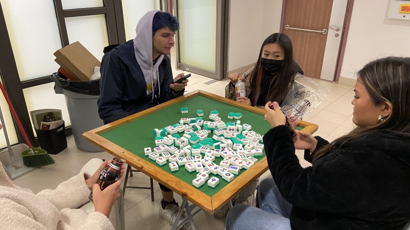 Students playing Mahjong